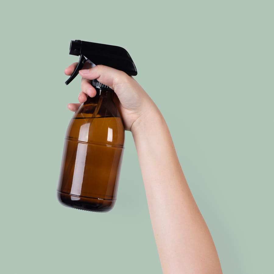 Hang a Tension Rod Under the Sink for Spray Bottles