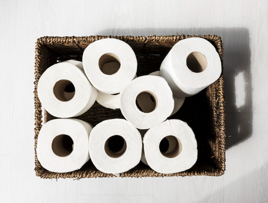 Store Toilet Paper Rolls in a Decorative Basket or Vase